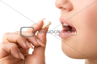 closeup taking pill