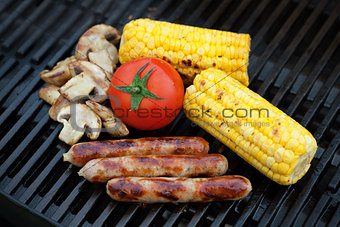 Grill bbq sausages and vegetables