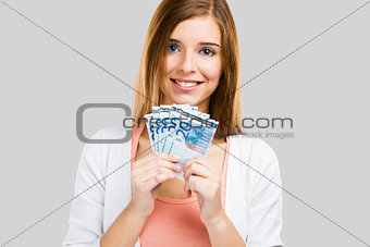Beautiful woman holding money
