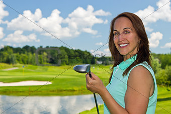 Attractive woman at the golf course 
