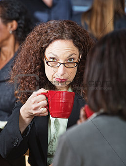 Serious Businesswoman with Cup