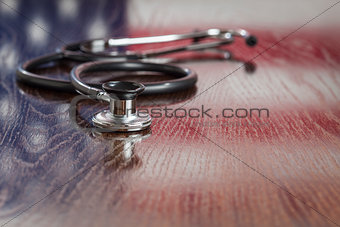 Stethoscope with American Flag Reflection on Table