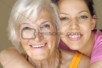 Grandmother and granddaughter smiling