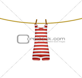 Striped retro swimsuit hanging on rope