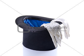 Black top hat with a pair of white gloves 