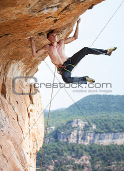 Rock climber on cliff.