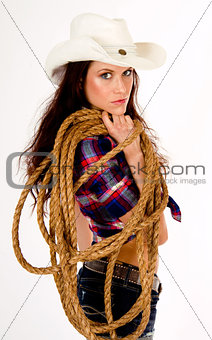 Hero Cowgirl White Hat Looks over Her Shoulder Holding Lasso