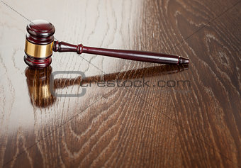 Wooden Gavel Abstract on Reflective Table