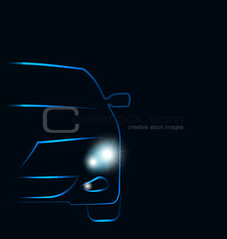 Silhouette of car with headlights in darkness