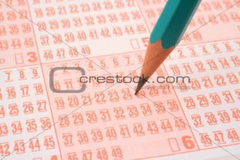 lottery ticket and pencil