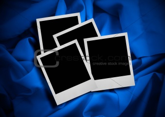 photo frames against textile background