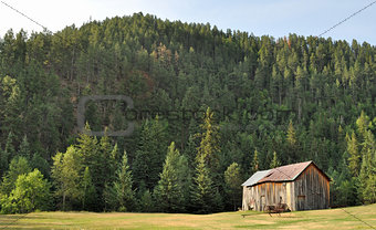Old barn sitting on the hillside