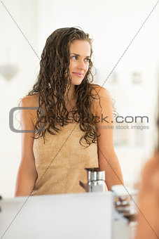 Portrait of young woman with wet hair in bathroom