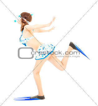 young girl runs with scuba diving equipment isolated on a white