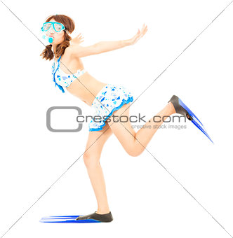 happy young girl runs with scuba diving equipment
