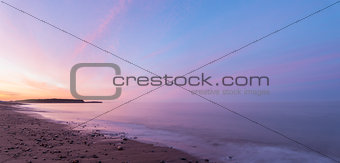 Panorama of  ocean beach at the crack of dawn