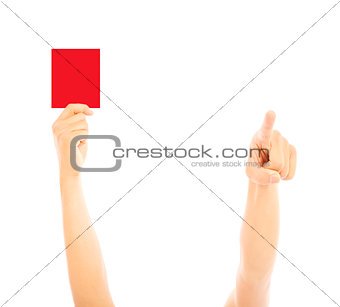 Hand of referee with red card and point the direction