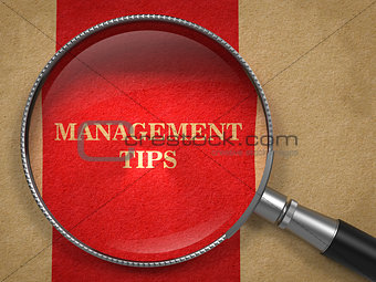 Management Tips Magnifying Glass on Old Paper.