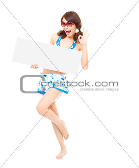 happy sunshine woman holding a board and ok gesture