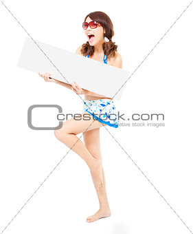  smiling pretty woman standing and holding a board 