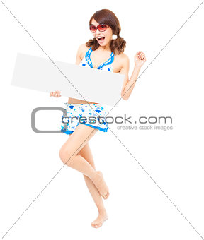  happy pretty woman standing and holding a board 
