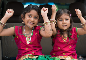 Indian girls sitting in car 