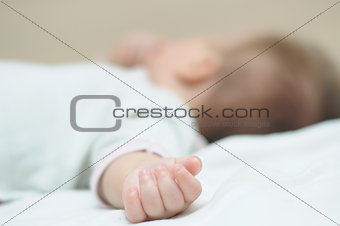 Hand of newborn 4-month baby
