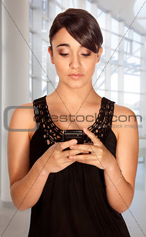 Young woman texting.