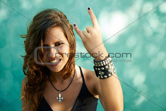 Portrait of young woman in heavy metal style