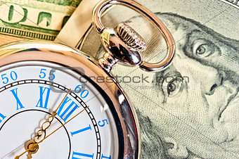 antique pocket watch on the dollar