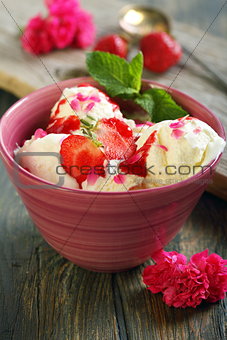 Ice cream with strawberries and mint.