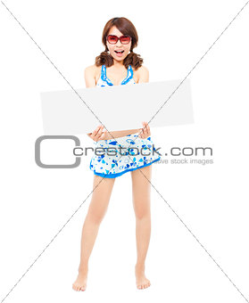  sunshine young  woman standing and holding a board 
