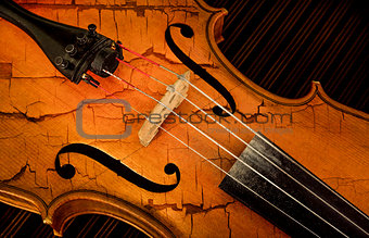 Detail of violin in filtered style as cracked paint