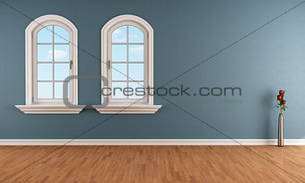 Blue room with two arched windows