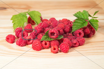 Raspberry berries on wooden background