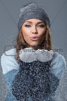 Cute girl with snowflakes having a good time