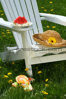 Closeup of slice of watermelon on adirondack chair