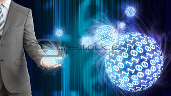 Businessman in suit hold spheres of glowing digits