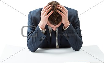 Businessman with head in hands
