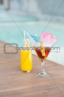 Two cocktails beside the swimming pool