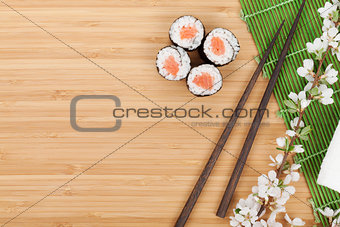 Sushi set, chopsticks and sakura branch