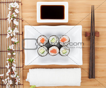 Sushi maki set with fresh sakura branch