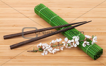 Chopsticks and sakura branch