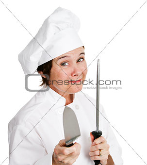 Chef Sharpens Kitchen Knife