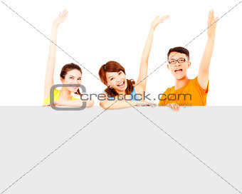 happy young people raise hand to greet with empty board