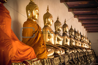 Buddha statues ina  row at Wat Arun in Bangkok, Thailand.