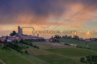 Small town on the hill under cloudy sky in Italy