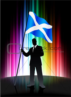 Scotland Flag with Businessman on Abstract Spectrum Background