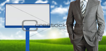 Businessman with blank billboard