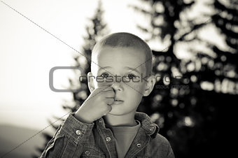 boy picking nose